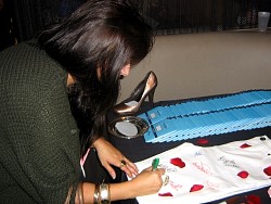 jazmin whitley signing wizard jeans for charity.jpg